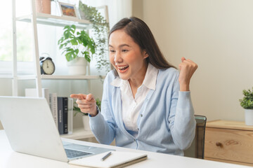 Good news reaction concept, Young adult females reading emails and have joyful expressions after receiving an offer of a job promotion from the company.