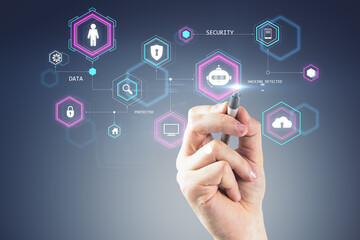 Hand with pen interacting with cybersecurity icons on futuristic interface.