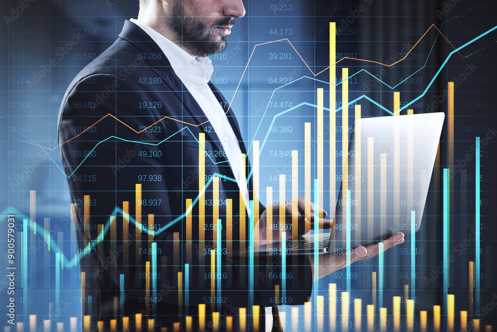 Poster businessman using laptop with financial graphs and data overlay.