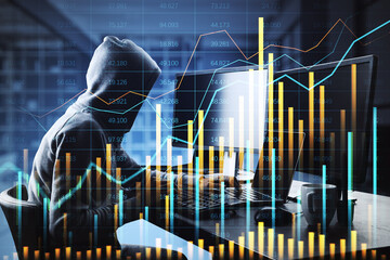 Hacker in a hoodie typing on a laptop with financial charts and data overlays.
