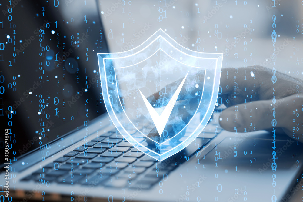 Aufkleber Digital shield icon overlaying a laptop keyboard, representing cybersecurity and data protection.