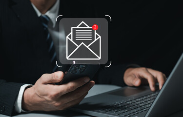 businessperson using smartphones check New email notifications and business digital online marketing. Inbox receiving electronic message alert. icon envelope virtual screen, communication technology.