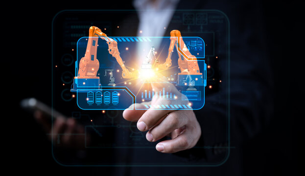 Modern dashboard interfaces are used by industrial engineers to monitor, manage automation robot arms in intelligent factories using real-time software for monitoring systems. digital manufacturing