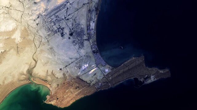 Iran Chabahar bay flying aerial satellite view, sunrise animation based on image by Nasa