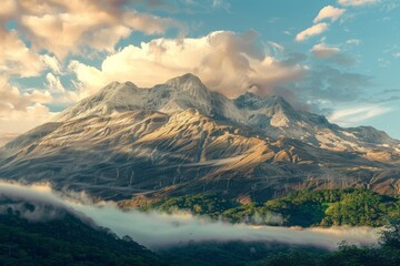 A majestic mountain range shrouded in mist and clouds.