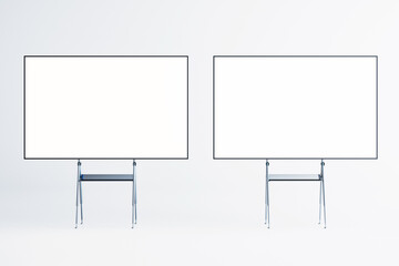 Two blank whiteboards on easels in a modern interior room. 3D Rendering