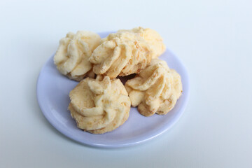 Kue sagu keju, or cheese sago cookies, isolated on white background