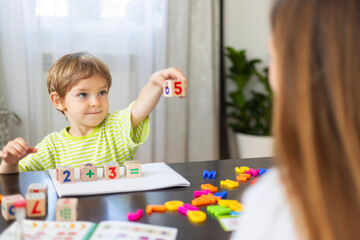 Child learning with number blocks at home