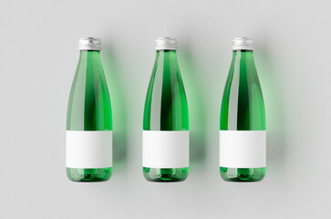 Small water bottle mockup with blank label. Green glass.