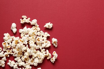 Delicious popcorn on a colored background