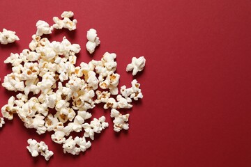 Delicious popcorn on a colored background