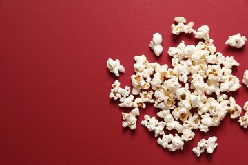 Delicious popcorn on a colored background