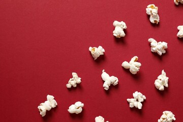 Delicious popcorn on a colored background