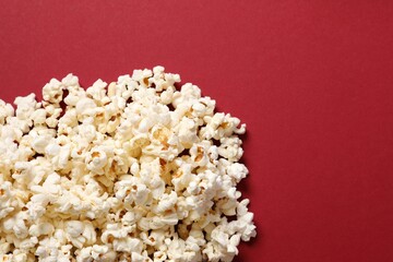 Delicious popcorn on a colored background