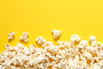 Delicious popcorn on a colored background