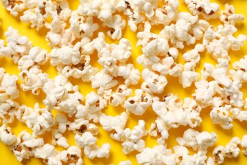 Delicious popcorn on a colored background