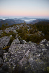 Breathtaking Rocky Landscape Overlooking Misty Valleys During Dawn in Mountain Range. Hiking in Carpathian Mountains, Ukraine