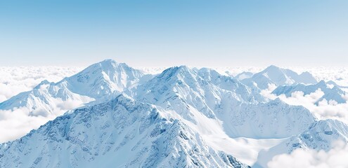 Fototapeta premium photo of mountains covered in snow with a bright blue sky in the background