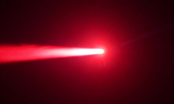 Crimson Beam Piercing the Void: A vibrant red laser cuts through a smoky black expanse, creating a dramatic interplay of light and shadow