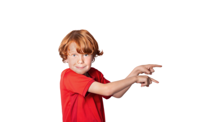 Little red-haired preschool child smiling at the camera and pointing at copy space, isolated on free png background.