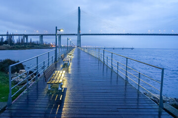 Fototapeta premium Rainy night image of the Vasco da Gama bridge from the Parque das Nações in Lisbon.