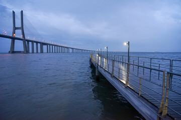 Rainy night image of the Vasco da Gama bridge from the Parque das Naçoes in Lisbon.