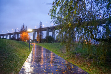 Pedestrian area in rainy night located in Parque das Nações in Lisbon.