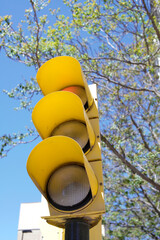 classic yellow traffic light seen from below