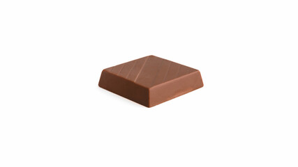 Milk chocolate pieces on a white background