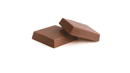 Milk chocolate pieces on a white background