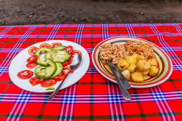 Meal in Uganda - pasta, potatoes and salad