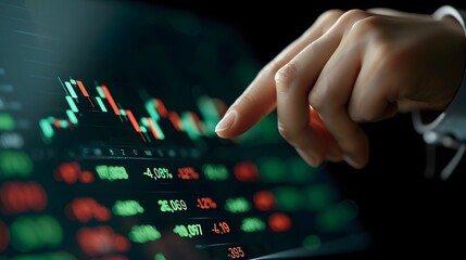 Naklejka premium Hand Tracing Stock Market Data: A close-up shot of a hand tracing a fluctuating stock market chart on a tablet screen, with numbers and data surrounding it, conveying the intensity and dynamism of the