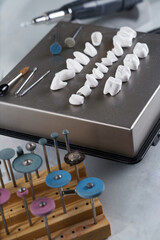 composition of primary crowns made of zircon and tools of dental technician attachments