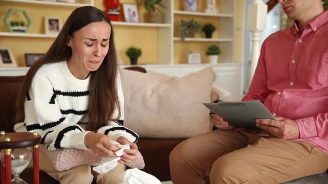 Woman visiting therapist counselor. Female on session of psychology help with depression, unhappy, exhausted, hopeless, mental disease, unwilling pregnancy, addiction to drugs, divorce, PTSD in war
