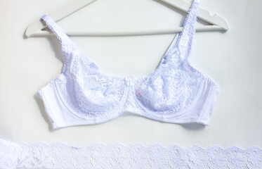 women's white bra without lining and foam rubber. Women's underwear on a white background