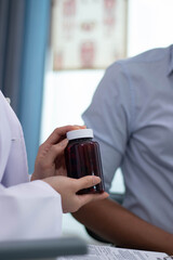 Beautiful Asian female doctor is leading the charge for penis treatment at the hospital clinic.