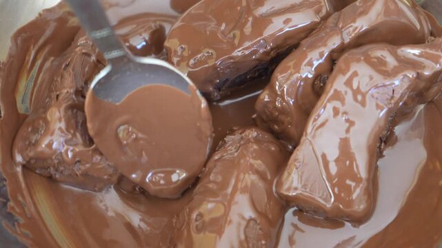 Chocolate pieces melting in a bain marie. 