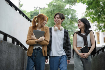 Three young adults are enjoying their time together between classes at university
