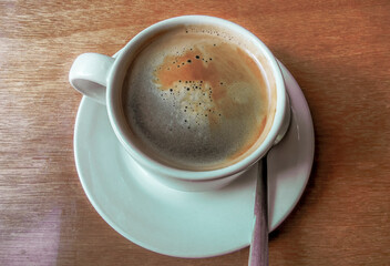 Cup of americano black coffee in restaurant cafe in Mexico.