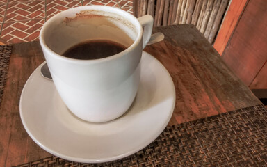 Cup of americano black coffee in restaurant cafe in Mexico.