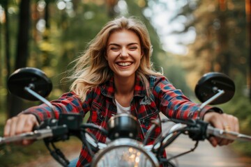 Naklejka premium Happy Woman Riding Motorcycle Outdoors Smiling in Forest Adventure, Freedom, Nature, Joy, Biking