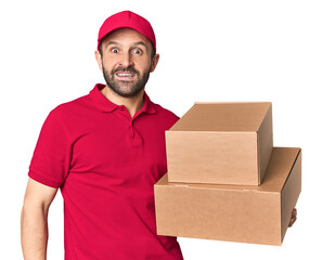 Hispanic male courier with boxes screaming very angry and aggressive.