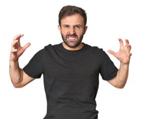 Studio portrait of young Hispanic male screaming with rage.