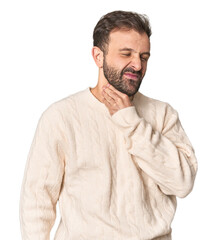 Naklejka premium Studio portrait of young Hispanic male suffers pain in throat due a virus or infection.