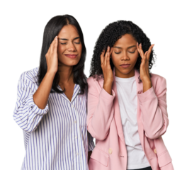 Young Latin businesswomen in studio touching temples and having headache.