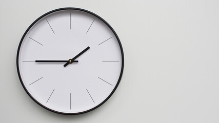 Wall Clock Showing 13.45/01.45 O'Clock on White Wooden Surface - Perfect for Time Management and Scheduling Concepts