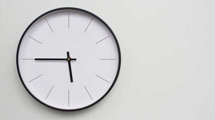 Wall Clock Showing 17.45/05.45 O'Clock on White Wooden Surface - Perfect for Time Management and Scheduling Concepts