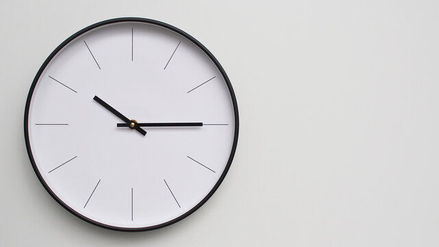 Wall Clock Showing 10.15/22.15 O'Clock on White Wooden Surface - Perfect for Time Management and Scheduling Concepts - Powered by Adobe