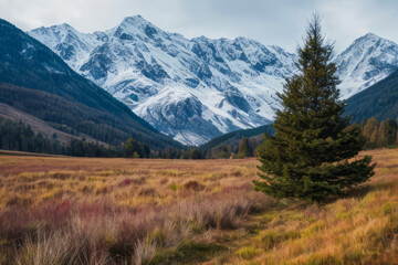Fototapeta premium Autumnal panorama of snow-capped Alps, with lush green valleys and towering peaks against a vibrant blue sky