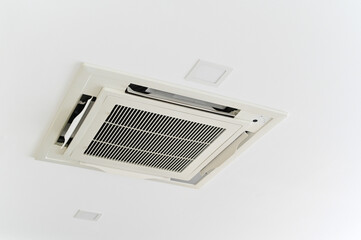 Ceiling-mounted air conditioning unit with modern design and sleek appearance.
